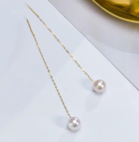 Gold pearl earrings