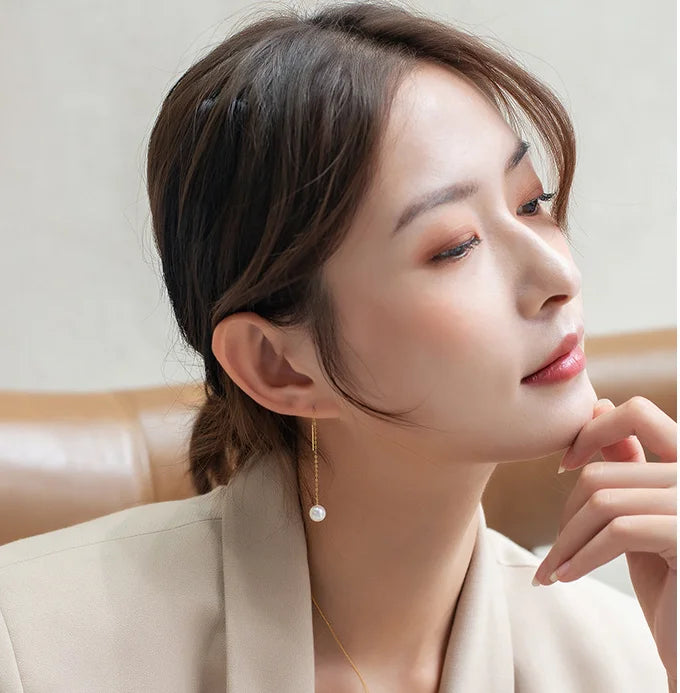 Gold pearl earrings